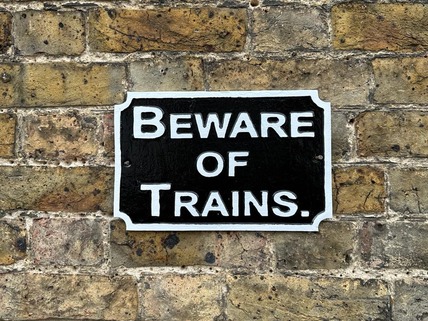 beware of trains sign